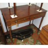 A mahogany late Regency washstand fitted two frieze drawers on turned legs.