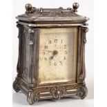 An Art Nouveau white metal, small mantel timepiece, height 9cm.