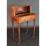 A fine Regency rosewood veneered and crossbanded small writing table, at the back,