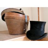 A top-hat in leather and canvas hat box