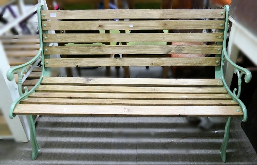 A garden bench, with painted cast iron frame, slatted seat and back