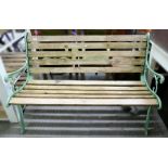 A garden bench, with painted cast iron frame, slatted seat and back