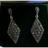 A sterling silver pair of marcasite drop earrings