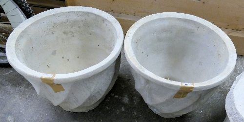 A pair of large stone composite garden pots