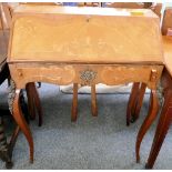 A French style kingwood and marquetry bureau, with gilt metal mounts 70cm wide