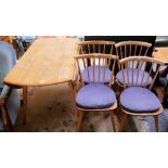 An Ercol dining suite, consisting of drop-leaf table, 4 matching stick back chairs (5)
