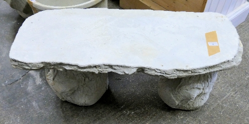 A stone composite garden bench