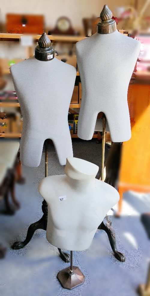 A pair of mannequins on tripod supports, together with a rubberized torso (3)