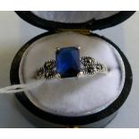 A sterling silver blue stone and marcasite ring