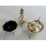 A silver three piece cruet Birmingham 1914, raised on shell capped legs