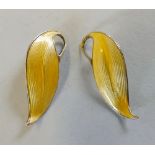 A pair of Norwegian sterling silver gilt clip-on earrings, as yellow enamelled leaves in the David