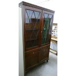 A glazed cabinet/bookcase