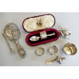 A silver mustard pot, Birmingham 1907, a silver bowl Birmingham 1905, three silver rattles and other