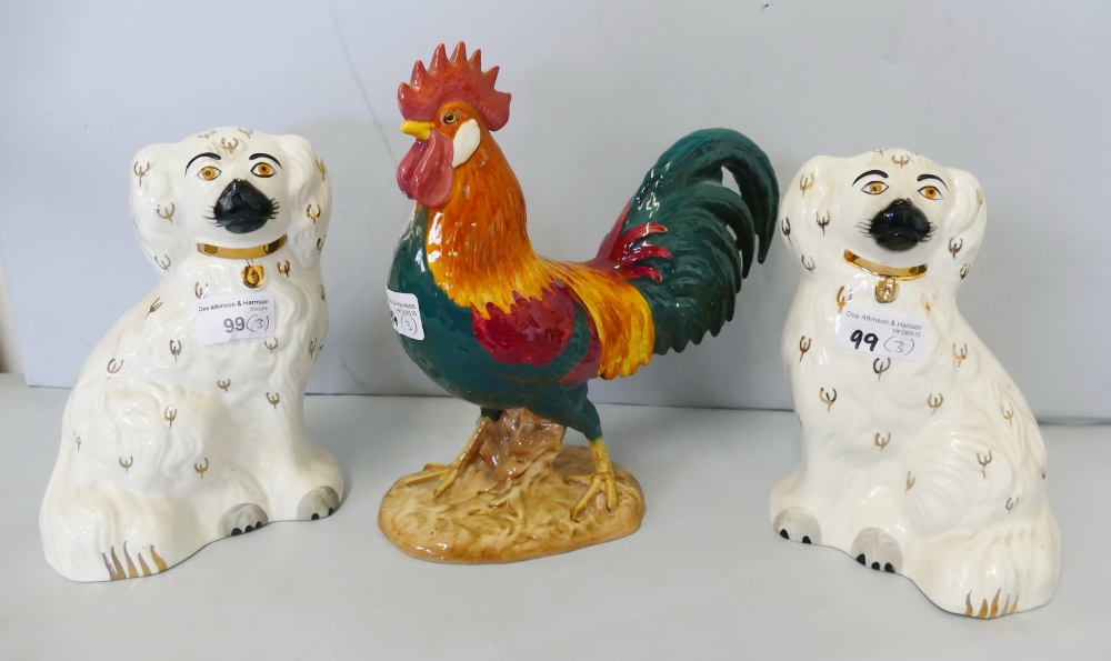Beswick; a figure of a Leghorn cockerel, 1892 and a pair of white Staffordshire flatback dogs,