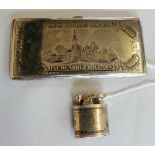 A novelty base metal and enamel $100 dollar bill cigarette case and lighter, the case series of