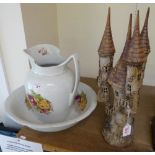 An Edwardian jug and bowl set, together with stoneware castle (2)