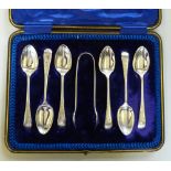 An Edwardian silver set of 6 teaspoons and sugar tongs, Sheffield 1909, cased