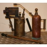 A brass Electricity Board paraffin burner, a copper weed killer and a brass weed killer (3).