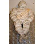 A seated Bibendum or Michelin Man figurine, height 56 cm.