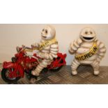 A cast iron Bibendum or Michelin man, astride a Harley Davidson style motor bike and standing