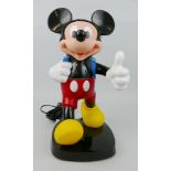 A Tyco Mickey Mouse telephone, the moulded plastic figure modelled walking with the handset as his