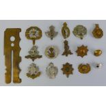 Thirteen British cap badges and collar dogs, including Coldstream Guards, RAC, Royal Marines,