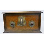 A three valve table top radio, badged "Brandes Radio", in wooden case, 43.5cm wide x 24cm high x