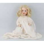 An Armand Marseille German bisque head doll, with applied hair, sleeping eyes, open mouth with teeth