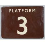 An enamelled iron railway platform number sign, of rounded oblong form with "Platform 3" in cream on