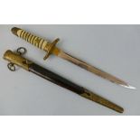 A WWII Japanese Naval Dirk, the 22.5cm steel single edged blade with narrow fuller to top edge,