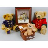 A modern Steiff soft plush teddy bear, in simulated leather suitcase box 28cm high, two Harrods