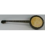 A five-string zither banjo, the rosewood stock stamped "W.E. Temlett Maker London