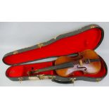 A Czechoslovakian half-size violin, with 31.5cm two-piece maple back and pine belly, bears label "