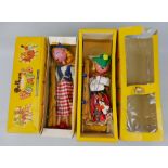 Two Pelham Puppets - gypsy girl in yellow card box and Mitzi in yellow card window box (2)