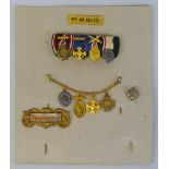 A WWI German group of four miniature medals, including 1914-18 Service Medal with swords, wound