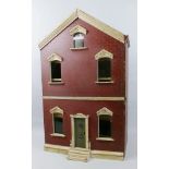 A late 19th/20th century wooden dolls house, as a Victorian double fronted town house, the simulated