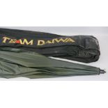 Fishing - a Team Daiwa rod bag and shelter umbrella