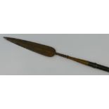 A cavalry lance, the steel split level spear head with twisted neck, on ebonised wooden shaft with
