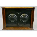 A two valve table top radio, probably by Graves, in wooden case with hinged lid lacking back, 34cm