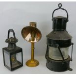 A ship's black painted steel masthead lamp, of cylindrical form with folding handles to top and