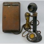 A black japanned steel and brass candlestick telephone, 31cm with mahogany cased bell box (2)