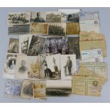 Twenty six real photographic postcards of military interest, including WWI soldiers and groups,