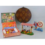 A JW Germany clockwork tin-plate fairground swinging boats ride, 22cm wide, an Equity Taiwan