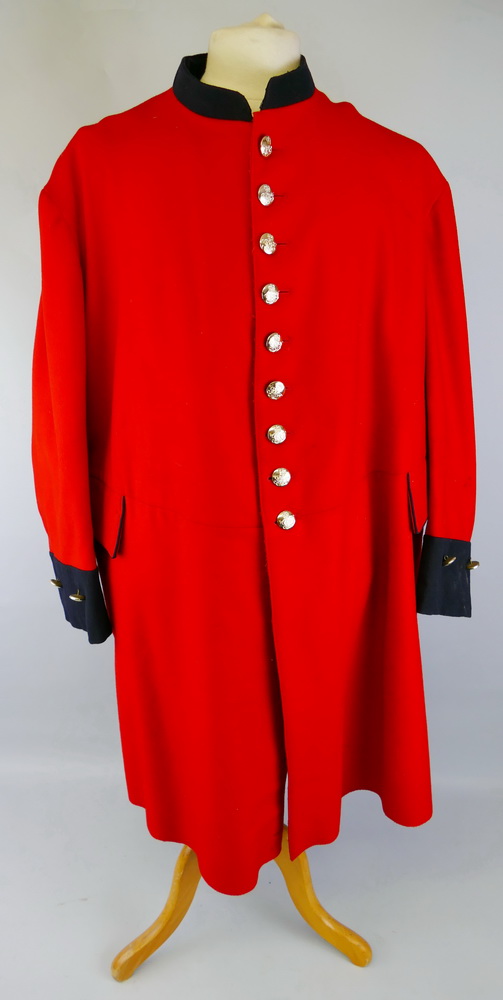 A Royal Hospital Chelsea "Chelsea Pensioners" long red coat, with traces of original paper supply