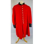 A Royal Hospital Chelsea "Chelsea Pensioners" long red coat, with traces of original paper supply
