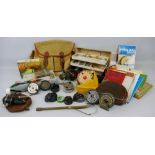 Fishing - a box containing fishing related items, including reels, gaff, bag, books, wires, floats