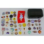 A collection of approximately fifty metal pin badges, including George VI coronation, Teddy Tail