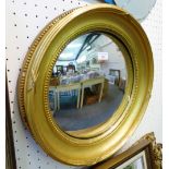 A circular convex wall mirror with gilt mount, 48cm diameter