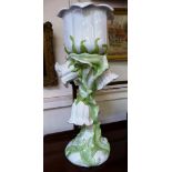 An Italian jardiniere on plinth, moulded in high relief with flower heads and leaves.