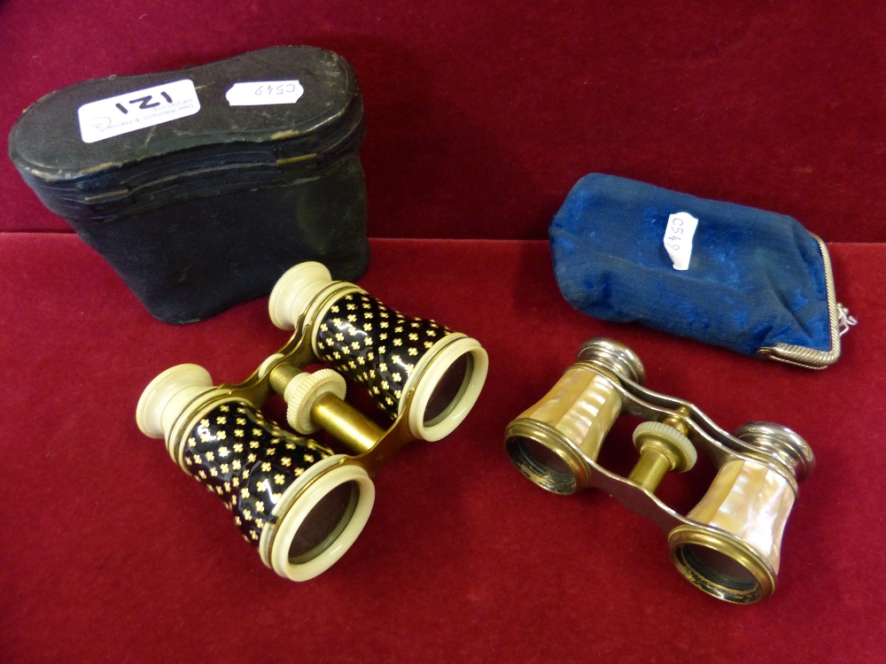 A French pair of mother-of-pearl mounted opera glasses by Chevalier, case and another pair with